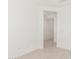 Bright hallway with neutral walls, tile floors, and doorways leading to other rooms in the home at 5358 W Las Palmaritas Dr, Glendale, AZ 85302