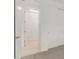 Hallway displaying new white plank flooring, a sliding door closet, and a walk-in closet at 5358 W Las Palmaritas Dr, Glendale, AZ 85302