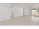 Spacious living room featuring tile floors, ample natural light, and sliding glass doors leading to the patio at 5358 W Las Palmaritas Dr, Glendale, AZ 85302