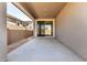 Covered patio leading to sliding glass doors and overlooking a backyard at 5358 W Las Palmaritas Dr, Glendale, AZ 85302