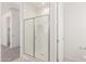 Bright bathroom featuring a glass-enclosed shower with subway tiles, and brushed nickel hardware at 5358 W Las Palmaritas Dr, Glendale, AZ 85302
