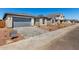 View of a new community with gray brick driveways, desert landscaping, and a fire hydrant at 5358 W Las Palmaritas Dr, Glendale, AZ 85302