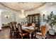 Chandelier illuminates the formal dining room; adjacent sitting room visible at 5508 N Quail Run Rd, Paradise Valley, AZ 85253