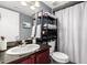 This bathroom features storage shelves, a marble countertop, and a shower with a curtain at 5995 N 78Th St # 1063, Scottsdale, AZ 85250