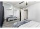 Bright bedroom with a mirror closet doors, a ceiling fan, and a comfortable bed at 5995 N 78Th St # 1063, Scottsdale, AZ 85250