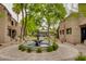 Community area featuring a decorative fountain, walking path, and lush landscaping at 5995 N 78Th St # 1063, Scottsdale, AZ 85250