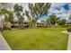 Expansive grassy common area surrounded by multi-story apartment buildings and mature trees at 5995 N 78Th St # 1063, Scottsdale, AZ 85250