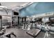 This gym features weights, multiple treadmills, machines, and a TV at 5995 N 78Th St # 1063, Scottsdale, AZ 85250