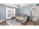 Comfortable living room with a plush sectional sofa, ceiling fan, and sliding glass doors to a private patio at 5995 N 78Th St # 1063, Scottsdale, AZ 85250