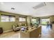 Bright living room with neutral tones, tile flooring, and multiple windows offering views of the exterior at 5995 N 78Th St # 1063, Scottsdale, AZ 85250