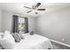 Serene main bedroom with a ceiling fan, a plush bed, and a window providing natural light at 5995 N 78Th St # 1063, Scottsdale, AZ 85250