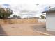 A spacious and low maintenance backyard featuring a sturdy wooden fence for added privacy at 614 S 92Nd Pl, Mesa, AZ 85208