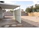 Backyard area with covered parking and gravel landscaping at 614 S 92Nd Pl, Mesa, AZ 85208