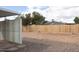Empty backyard, fenced for privacy with graveled landscaping at 614 S 92Nd Pl, Mesa, AZ 85208