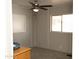 This cozy bedroom is filled with natural light from two windows at 614 S 92Nd Pl, Mesa, AZ 85208