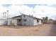 Back of home with gravel yard, partially covered patio, and a view of the home's construction at 614 S 92Nd Pl, Mesa, AZ 85208