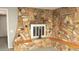 Living room fireplace with rock surround, a cozy and inviting space to relax and unwind at 614 S 92Nd Pl, Mesa, AZ 85208
