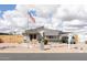 Charming single-story home featuring a landscaped front yard and an American flag at 614 S 92Nd Pl, Mesa, AZ 85208