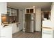 Well-lit kitchen featuring stainless steel appliances and ample cabinet space at 614 S 92Nd Pl, Mesa, AZ 85208