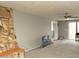 Open living room with carpet, ceiling fan, stone fireplace and a sliding glass door at 614 S 92Nd Pl, Mesa, AZ 85208