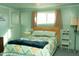 Cozy bedroom with a bed, green bedding, a dresser, and a bright window at 643 S 93Rd St, Mesa, AZ 85208