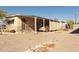 Single-story home with a carport, desert landscaping, and a neutral color palette at 643 S 93Rd St, Mesa, AZ 85208