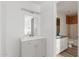 Bright bathroom with a modern vanity and light fixture; second bathroom can be seen through doorway at 6615 N 44Th Ave, Glendale, AZ 85301
