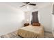 Bedroom featuring a ceiling fan, a wooden floor, a floral bedding, and a dresser at 6615 N 44Th Ave, Glendale, AZ 85301
