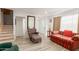 Open living room with wood floors, large mirror, with stairs to upper level at 6615 N 44Th Ave, Glendale, AZ 85301