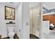 Modern bathroom featuring sleek tiles, glass enclosed shower, and minimalist decor at 7301 E 3Rd Ave # 121, Scottsdale, AZ 85251