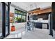 Bright kitchen with black cabinets, stainless steel appliances, industrial accents and large windows at 7301 E 3Rd Ave # 121, Scottsdale, AZ 85251