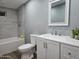 This modern bathroom has a bathtub-shower combo with updated fixtures, plus a vanity and mirror at 770 S Pinal Dr, Apache Junction, AZ 85120