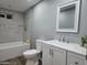 The clean bathroom features a shower-tub combination, a toilet, and a sink with a mirror at 770 S Pinal Dr, Apache Junction, AZ 85120