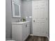 Bathroom with a white vanity, mirror, modern fixtures and wood-look vinyl floors at 770 S Pinal Dr, Apache Junction, AZ 85120