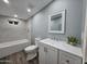 This modern bathroom has a bathtub-shower combo with updated fixtures, plus a vanity and mirror at 770 S Pinal Dr, Apache Junction, AZ 85120