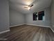 This bedroom features a ceiling fan and large window overlooking the outdoors at 770 S Pinal Dr, Apache Junction, AZ 85120