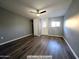 This bedroom features a ceiling fan, a large closet, and access to the outside at 770 S Pinal Dr, Apache Junction, AZ 85120
