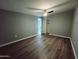 Spacious bedroom with wood floors and a ceiling fan offers ample space and modern comfort at 770 S Pinal Dr, Apache Junction, AZ 85120