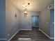 Dining area with decorative lighting and adjacent doorway at 770 S Pinal Dr, Apache Junction, AZ 85120