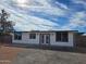Charming single-story home showcasing a fresh exterior, complemented by a well-maintained front yard and inviting curb appeal at 770 S Pinal Dr, Apache Junction, AZ 85120