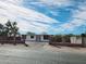 Charming single-story home showcasing a fresh exterior, complemented by a gated front yard and inviting curb appeal at 770 S Pinal Dr, Apache Junction, AZ 85120