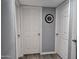 Hallway featuring multiple doors and consistent gray wall paint at 770 S Pinal Dr, Apache Junction, AZ 85120