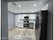 Kitchen features stainless appliances, new white cabinets, and quartz countertops at 770 S Pinal Dr, Apache Junction, AZ 85120