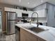 Well-lit kitchen with quartz countertops and stainless steel appliances at 770 S Pinal Dr, Apache Junction, AZ 85120