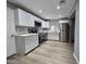 Kitchen features stainless appliances, new white cabinets, and quartz countertops at 770 S Pinal Dr, Apache Junction, AZ 85120