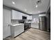 Kitchen features stainless appliances, new white cabinets, and quartz countertops at 770 S Pinal Dr, Apache Junction, AZ 85120
