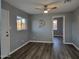 Bright room with laminate flooring, ceiling fan, and natural light from the window at 770 S Pinal Dr, Apache Junction, AZ 85120