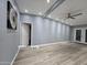 Spacious living room featuring modern gray walls and a ceiling fan at 770 S Pinal Dr, Apache Junction, AZ 85120