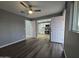 Bright room with laminate flooring and white walls. Access to kitchen at 770 S Pinal Dr, Apache Junction, AZ 85120