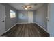 Bright room with laminate flooring, ceiling fan, and natural light from the window at 770 S Pinal Dr, Apache Junction, AZ 85120